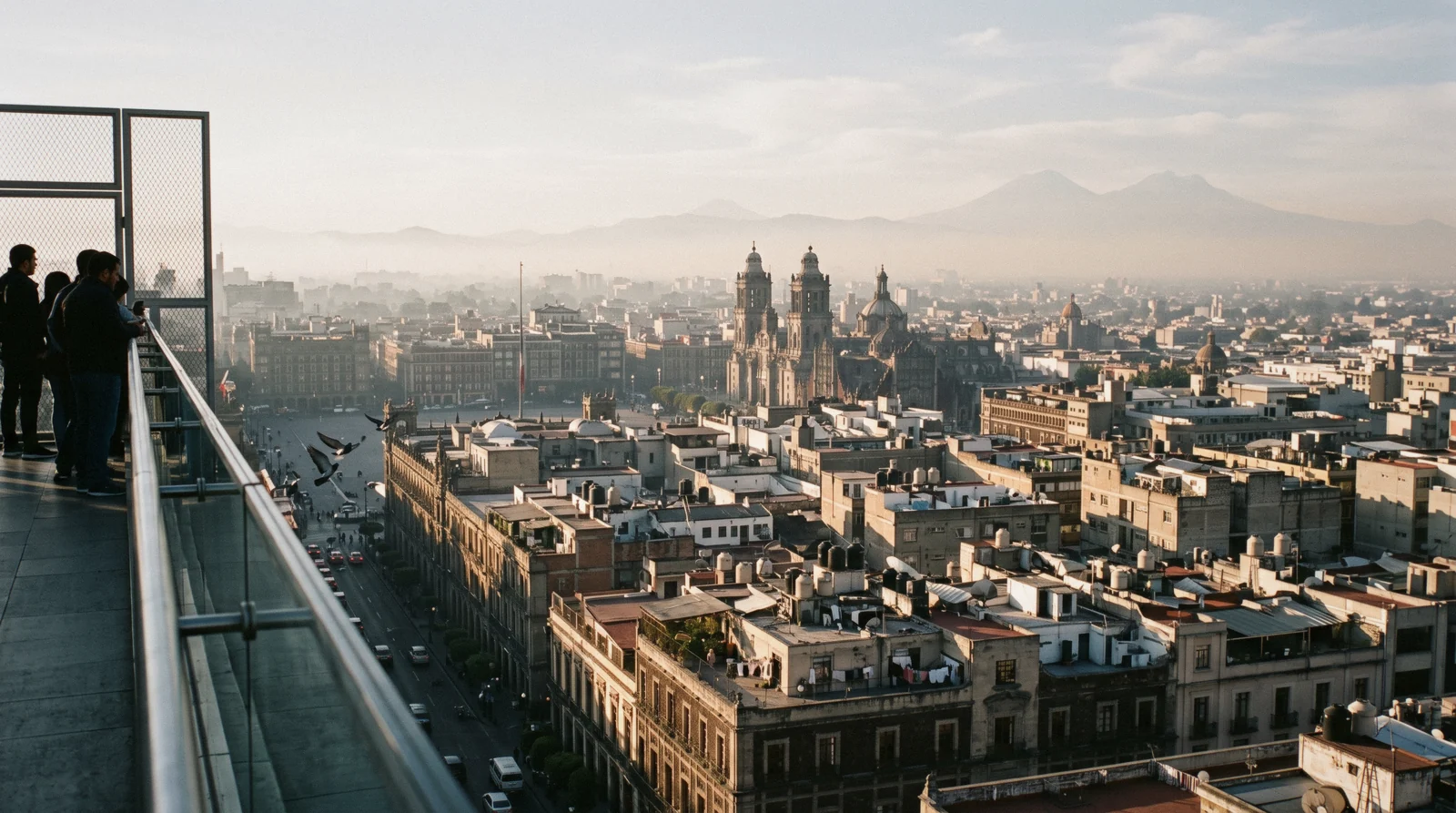 Dawn over the rooftops and volcanoes of the basin, the starting view for Mexico City trip planning