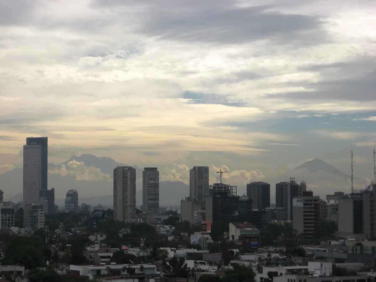 The Mexico City skyline with the volcanoes Popocatépetl and Iztaccíhuatl on the horizon, the view a clear dry-season morning gives